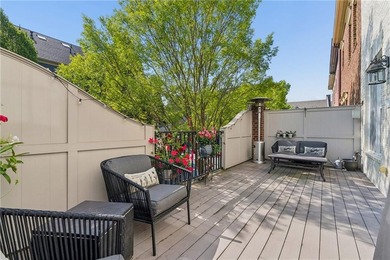 Set behind the gates of One Ivy Walk, this brick townhome offers - photo 19