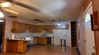 Fixer-Upper Opportunity! Welcome to a home full of potential in - photo 11