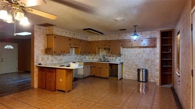 Fixer-Upper Opportunity! Welcome to a home full of potential in - photo 12