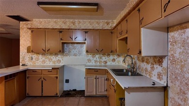 Fixer-Upper Opportunity! Welcome to a home full of potential in - photo 13