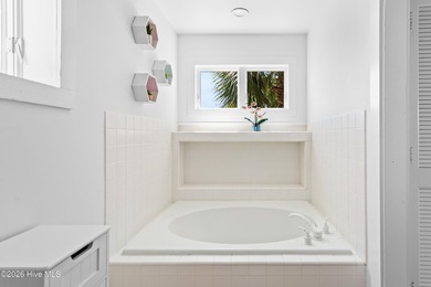 Set on one of Wrightsville Beach's most coveted streets in the - photo 32