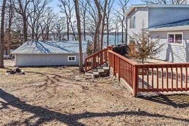 Newer metal roof, gutters & downspouts, newer vinyl siding - photo 43