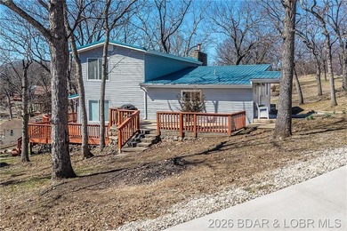 Newer metal roof, gutters & downspouts, newer vinyl siding - photo 44