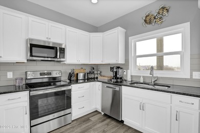 Experience stunning sound-side living in this well-maintained