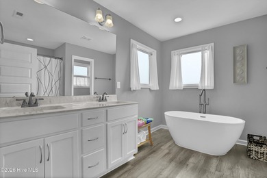 Experience stunning sound-side living in this well-maintained