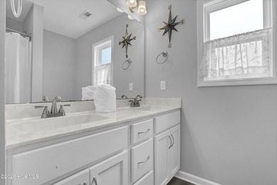 Experience stunning sound-side living in this well-maintained