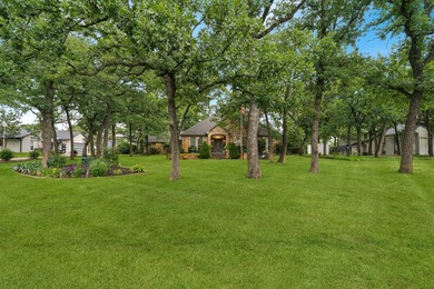 Beautifully situated on a heavily treed one-acre lot in the - photo 1
