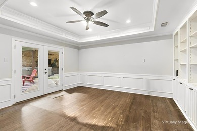 Beautifully situated on a heavily treed one-acre lot in the - photo 8