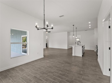 Tile throughout. Quartz countertops. Impact windows. Paver - photo 21