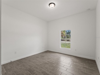 Tile throughout. Quartz countertops. Impact windows. Paver - photo 31