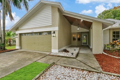 BEAUTIFULLY UPDATED 4 BR/2 BA LAKEFRONT HOME in DESIRABLE - photo 2