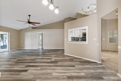 BEAUTIFULLY UPDATED 4 BR/2 BA LAKEFRONT HOME in DESIRABLE - photo 3