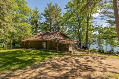 On the shores of beautiful Woman Lake, this home captures the - photo 4