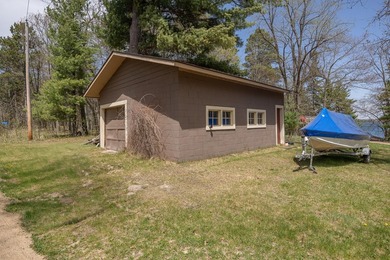 On the shores of beautiful Woman Lake, this home captures the - photo 5