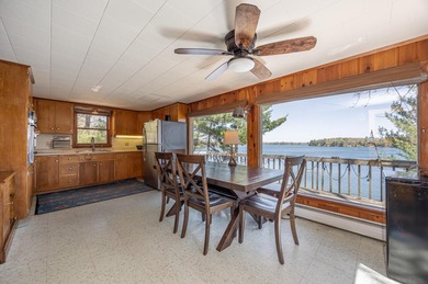 On the shores of beautiful Woman Lake, this home captures the - photo 6