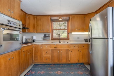 On the shores of beautiful Woman Lake, this home captures the - photo 8