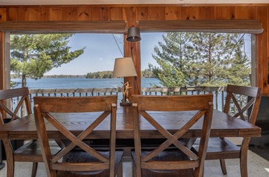 On the shores of beautiful Woman Lake, this home captures the - photo 9