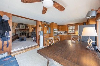 On the shores of beautiful Woman Lake, this home captures the - photo 10