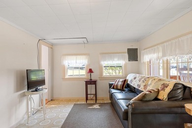 Tucked into a charming lake community, this property at 32 Ells - photo 16