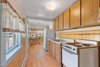 Tucked into a charming lake community, this property at 32 Ells - photo 17