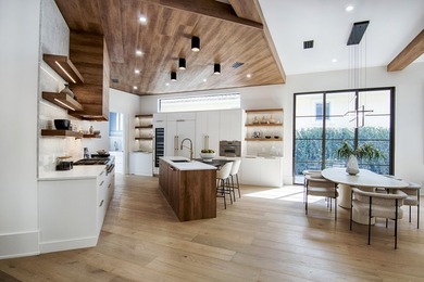 Step into this newly constructed residence that transcends the - photo 19