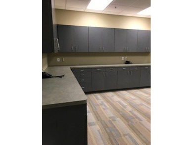 The first floor has a vestibule entrance with a stairwell and