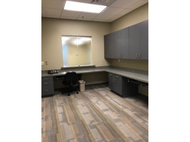 The first floor has a vestibule entrance with a stairwell and