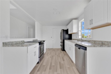 **SHORT SALE!** Light-filled corner home on the Caloosahatchee