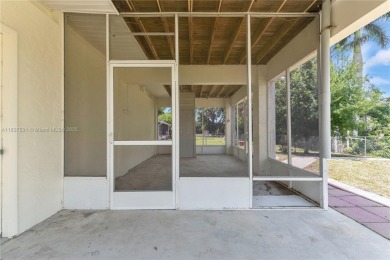 **SHORT SALE!** Light-filled corner home on the Caloosahatchee