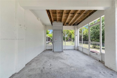 **SHORT SALE!** Light-filled corner home on the Caloosahatchee