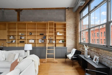 Located in the historic 801 lofts, this authentic loft offers a - photo 5