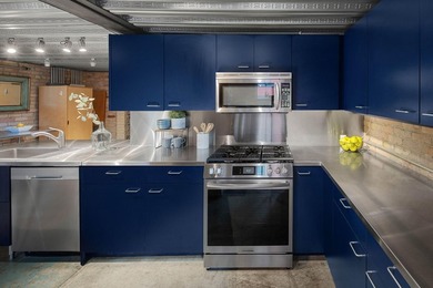 Located in the historic 801 lofts, this authentic loft offers a - photo 10