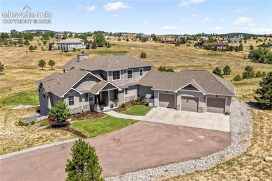 Located in the Kings Deer community, this custom two story home - photo 1
