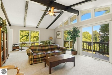 Nestled among mature hardwoods on a private wooded setting, this - photo 12