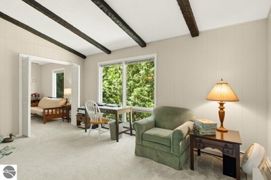 Nestled among mature hardwoods on a private wooded setting, this - photo 14