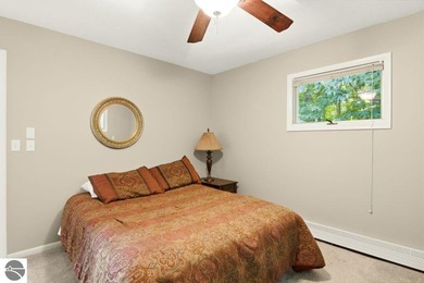 Nestled among mature hardwoods on a private wooded setting, this - photo 17