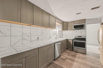 Situated on a FULL ACRE in lovely North Merritt Island, this - photo 3