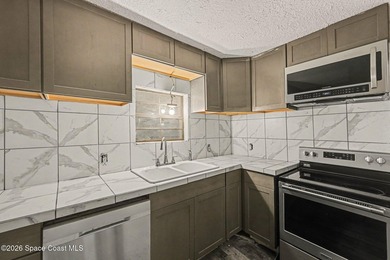 Situated on a FULL ACRE in lovely North Merritt Island, this - photo 8