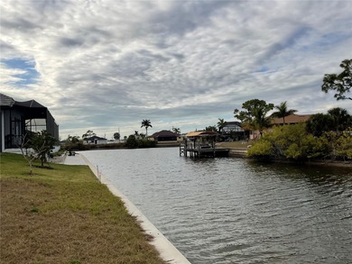Vacant waterfront lot in a quiet NW Cape Coral neighborhood. An - photo 3