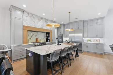 Luxury lake living awaits inside the gated Pointe at Hurricane - photo 11