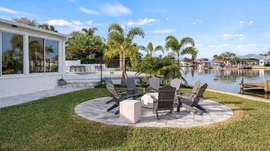 Set along an extraordinary 149 feet of water frontage, 102 E - photo 11