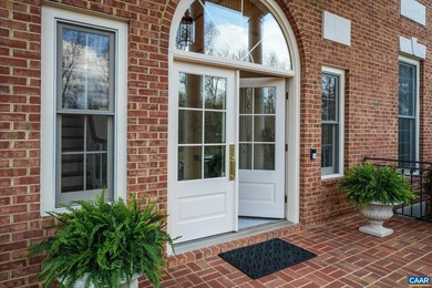 Privately sited on 21 landscaped acres, this stately brick - photo 4