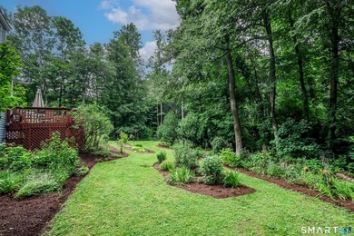 Nestled on a private, beautifully landscaped lot in the highly - photo 30