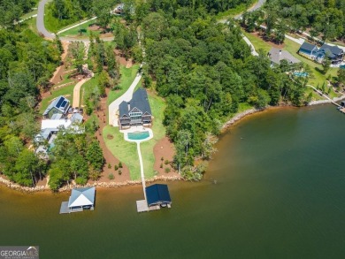 New Price - Lakefront Paradise: Custom Estate with Stunning Pool - Lake Home For Sale in Monticello, Georgia