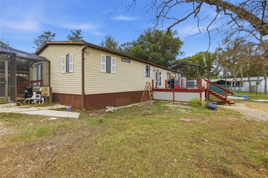 Set on just over half an acre, this 1989 double-wide mobile home - photo 33