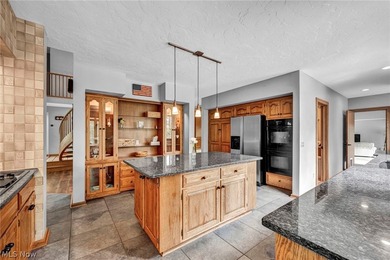 Nestled on a breathtaking wooded lot on the - photo 11