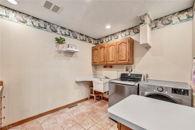 Nestled on a breathtaking wooded lot on the - photo 14