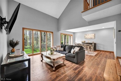 Nestled on a breathtaking wooded lot on the - photo 16