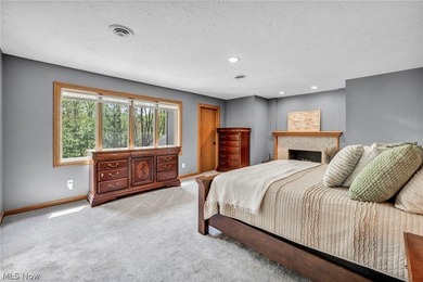 Nestled on a breathtaking wooded lot on the - photo 26