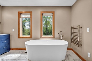 Nestled on a breathtaking wooded lot on the - photo 29